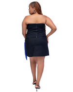 Load image into Gallery viewer, Woman wearing a black strapless dress with a blue clutch on a white background