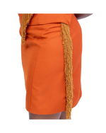 Load image into Gallery viewer, Orange skirt with gold fringe details on a white background