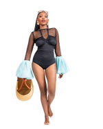 Load image into Gallery viewer, Woman wearing a black swimsuit with sheer sleeves and blue cuffs, holding a yellow bag.