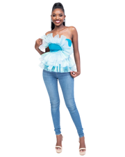 Woman wearing a blue peplum top and jeans on a white background