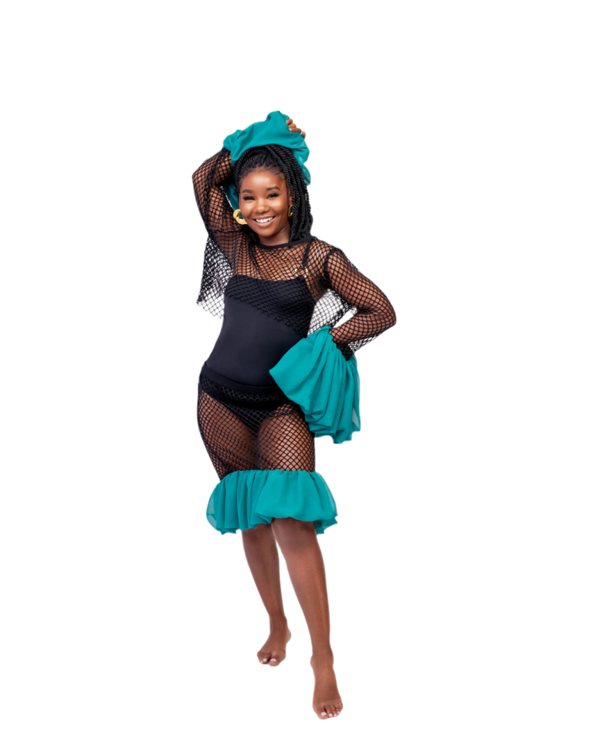 Young girl in a black swimsuit with teal accents posing against a white background