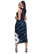 Load image into Gallery viewer, Woman wearing a black and blue patterned skirt with white feather details on a white background
