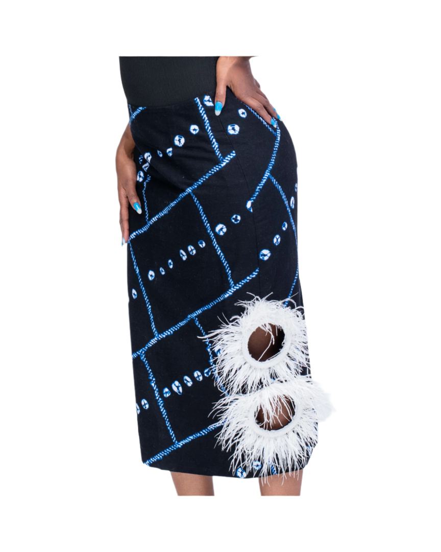 Black skirt with blue patterns and white fluffy accents on a white background